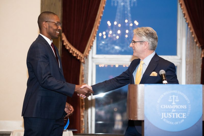 Dean Bowman presents Champion for Justice Award to The Honorable Christopher K. Smith L'07