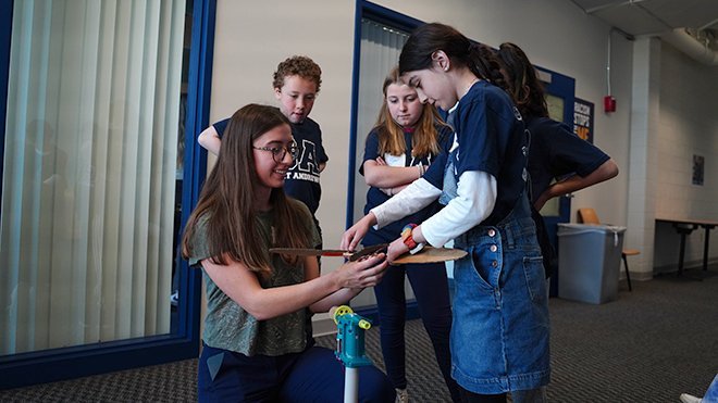 Student helps 4th graders build wind turbine